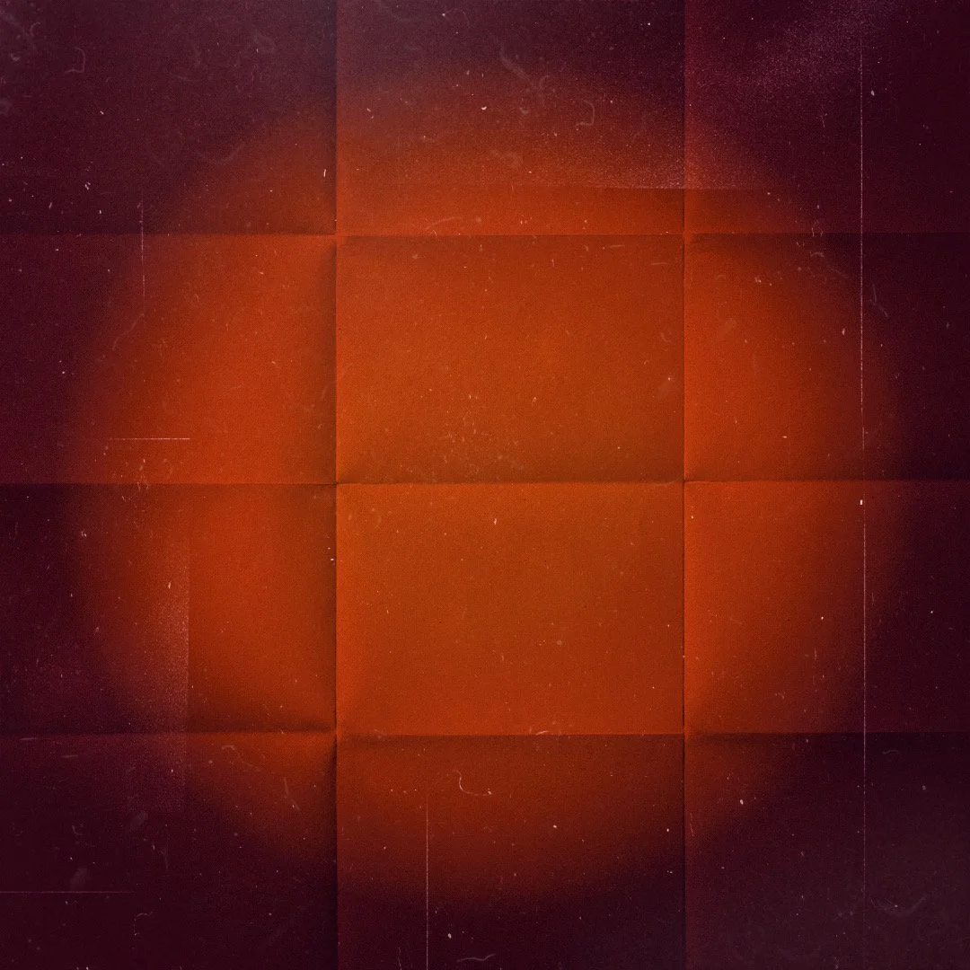 A burgundy background with a soft circle in a bright warm orange in the middle and dust and fold textures.