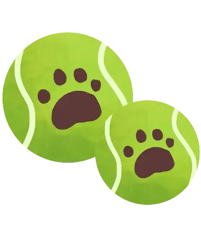 Two green tennis balls with paw print designs on them.