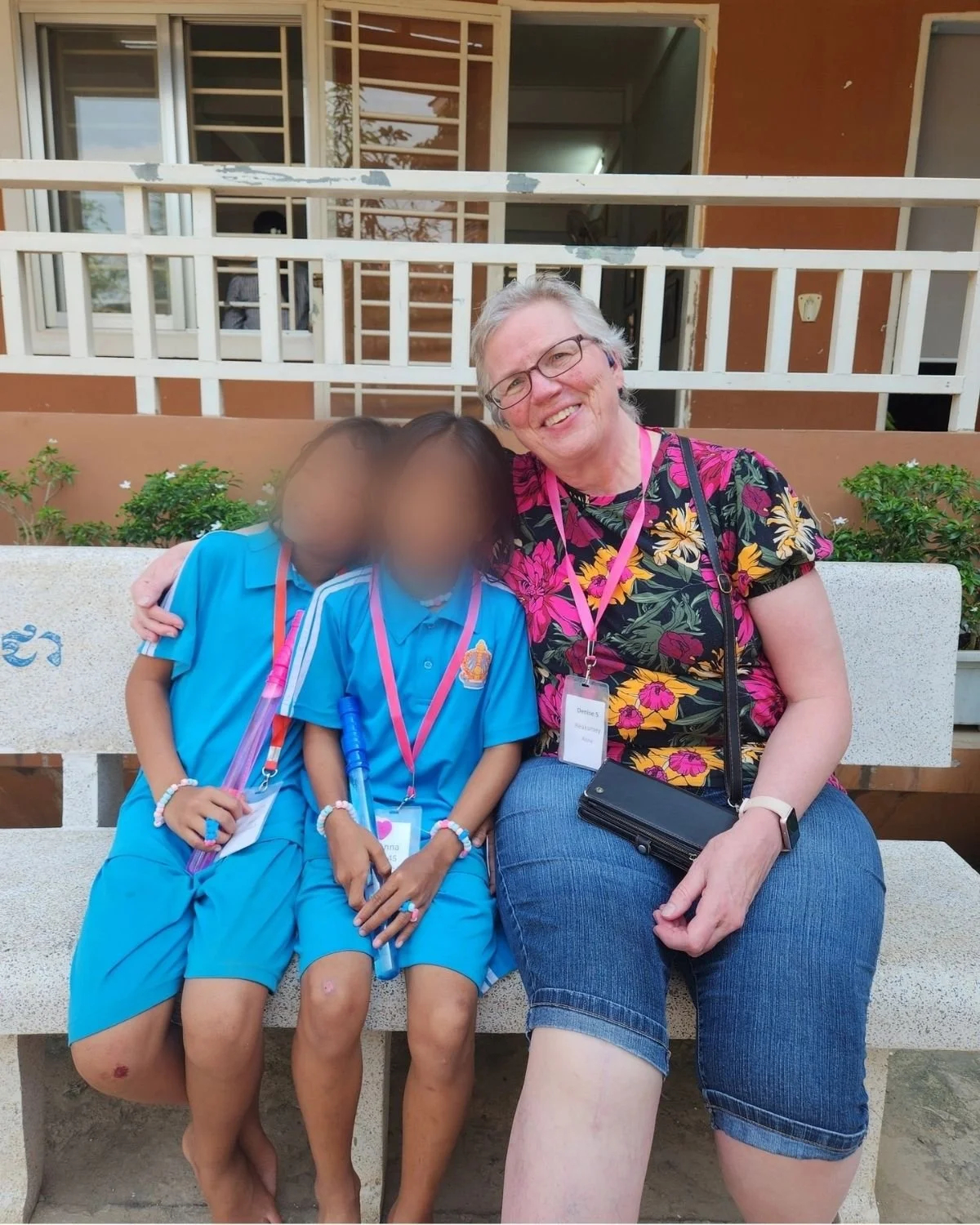 Heart mother sitting with two heart daughters
