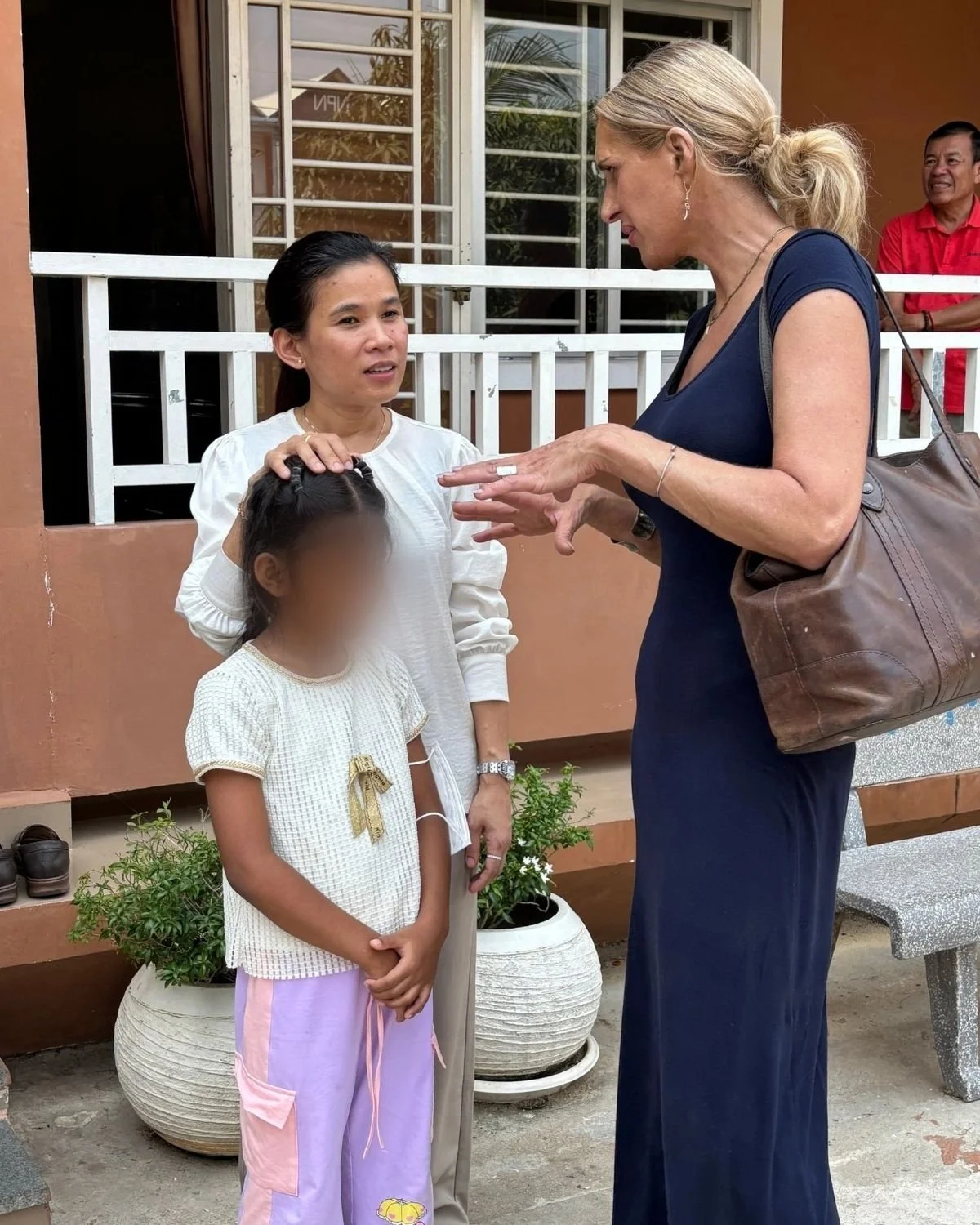 Ruth and Somaly chatting with a heart daughter