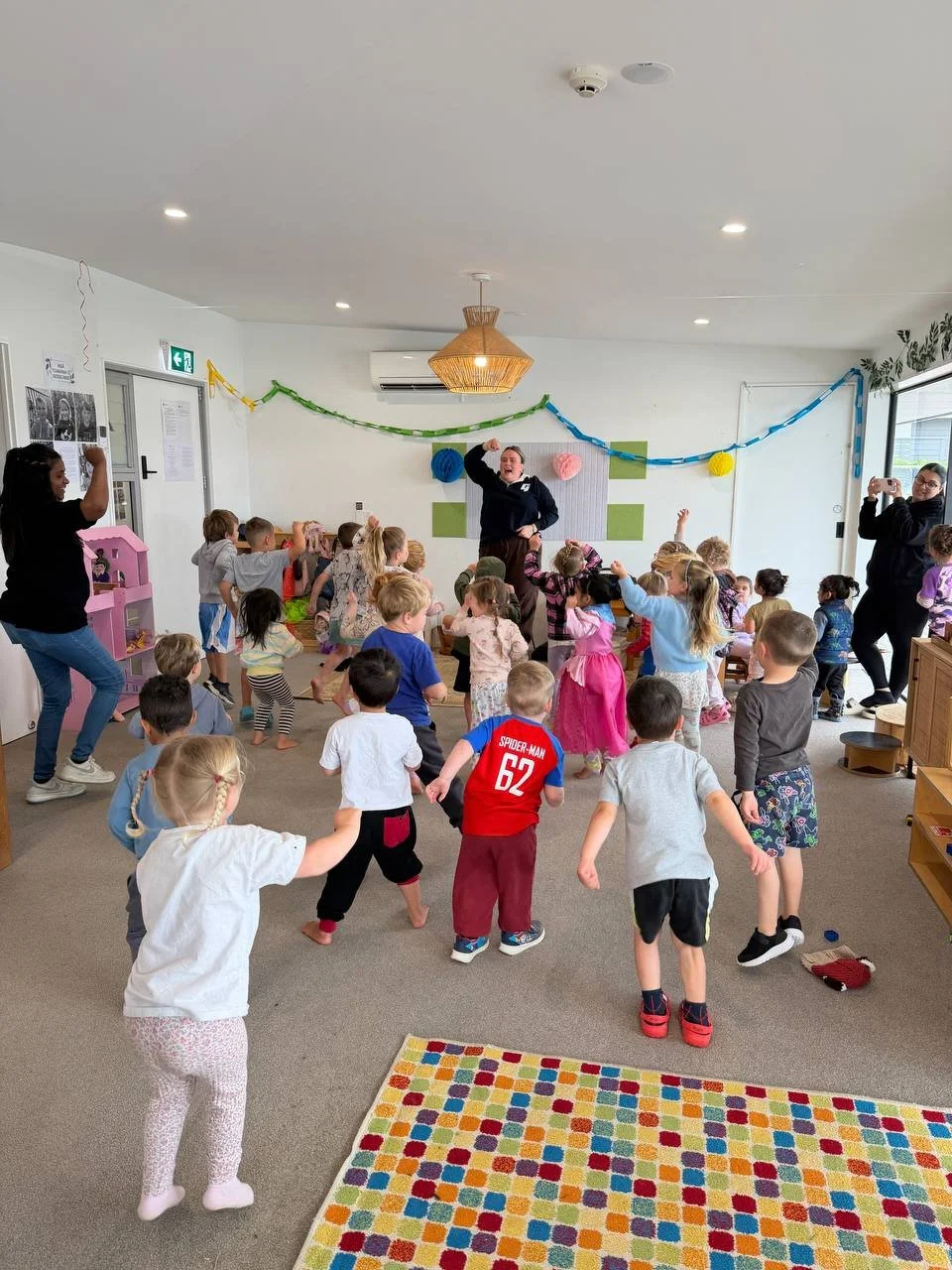 Children enjoying group activities at The Village Early Learning Centre Pukekohe, encouraging confidence, movement, and social development