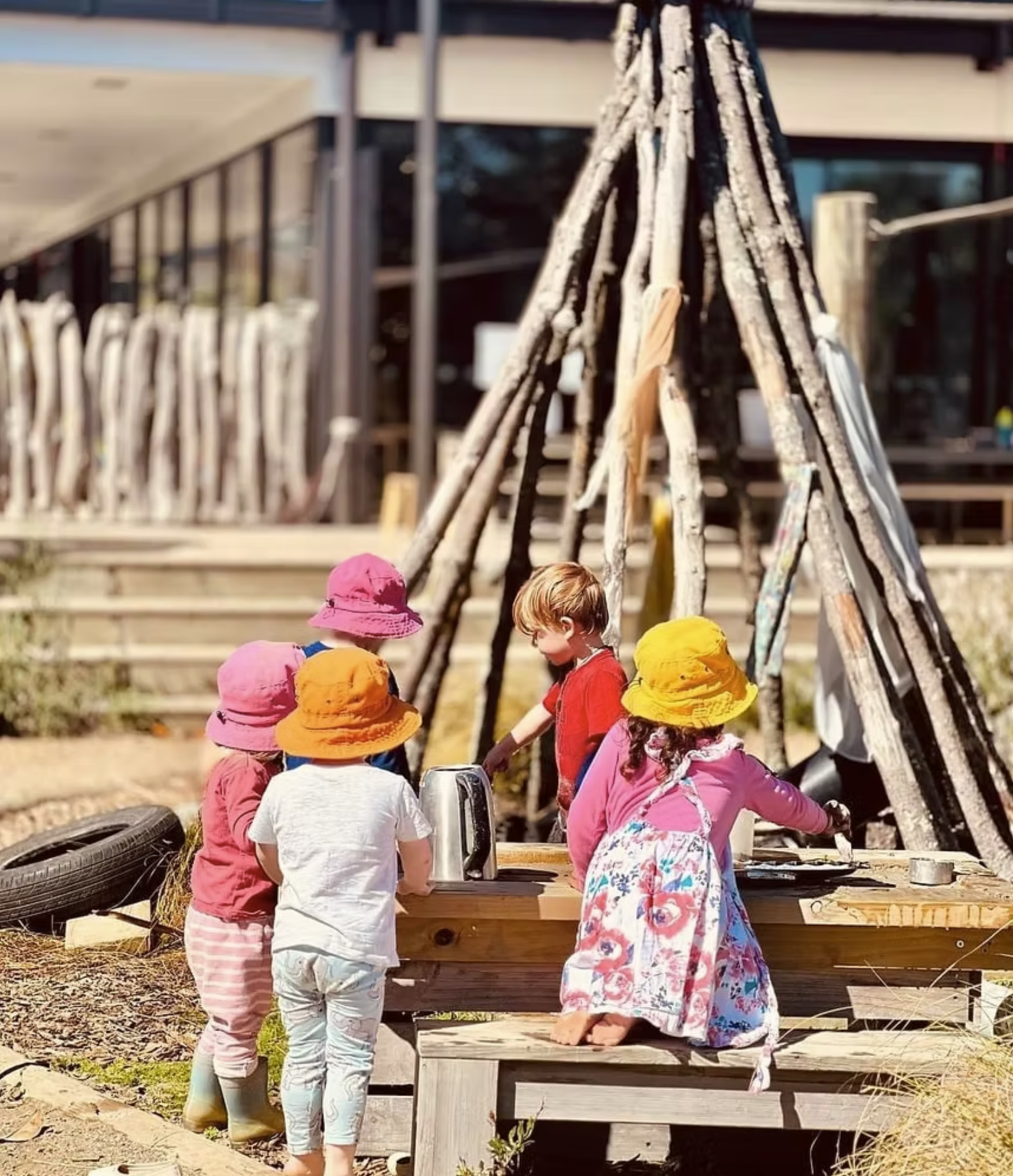 Outdoor group learning at The Village Early Learning Centre Pukekohe, encouraging teamwork, creativity, and exploration
