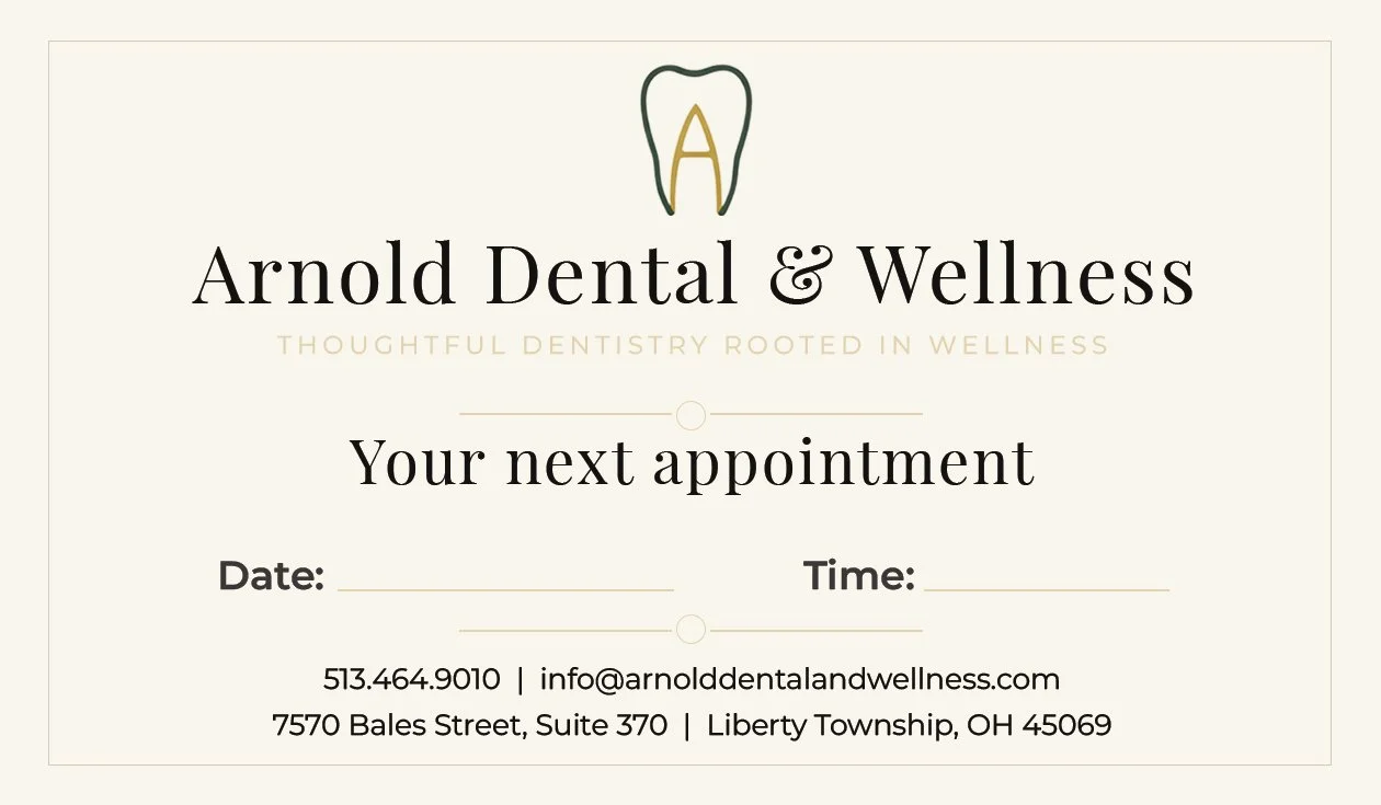 Appointment card for Arnold Dental & Wellness featuring a tooth logo, with spaces for date and time, and contact information.