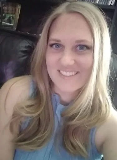 Ally of Huntsville Behavior Associates with long blonde hair, smiling at the camera in a professional close-up portrait.