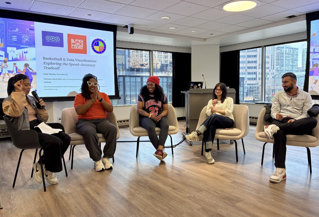 Five-person panel discussing basketball and data in a modern conference room.