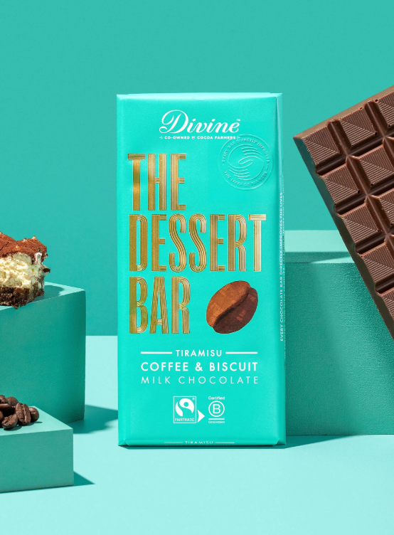 Turquoise chocolate bar packaging labeled 'The Dessert Bar' with 'Tiramisu, Coffee & Biscuit, Milk Chocolate' flavors, displayed against a matching turquoise background.