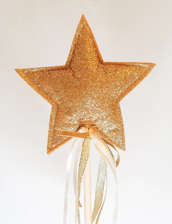 Gold glitter star with ribbons on a stick.