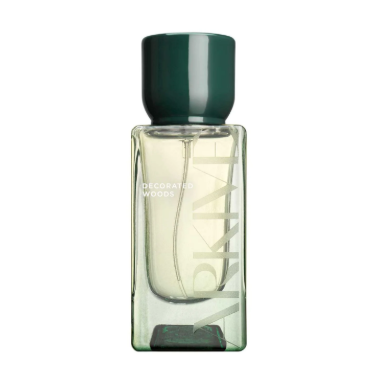 A bottle of Jo Malone decorative woods perfume with a dark green cap and a clear rectangular body.