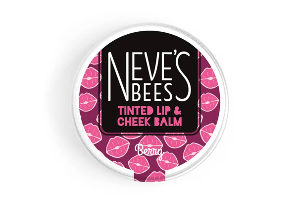 Round container label for Neve's Bees tinted lip and cheek balm, featuring a pink background with lip print pattern.