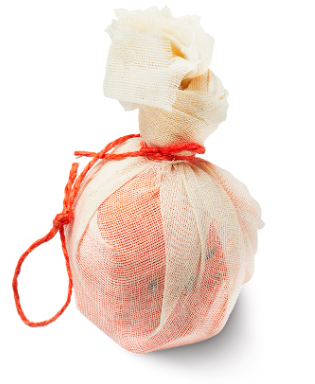 A small cloth bundle tied with a red string, resembling a wrapped package or gift.