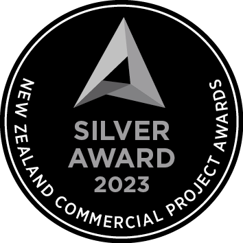 Logo for the New Zealand Commercial Project Awards 2023, featuring a stylized letter A in shades of gray and black.