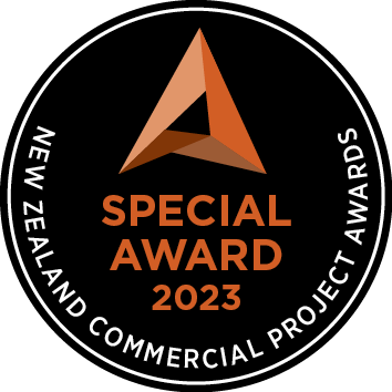 Logo for the 2023 New Zealand Commercial Project Awards, featuring a stylized triangular emblem and text
