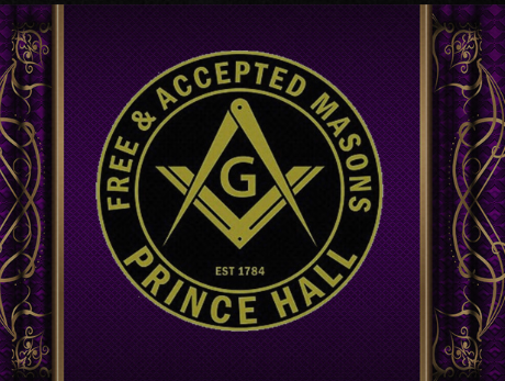 Prince Hall Masonic logo with gold emblem and text on purple background with ornate purple and gold border.