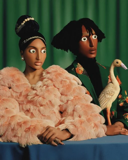 Two African-American mannequins, one female and one male, dressed in elaborate clothing, with a green curtain background. The female mannequin wears a pink feathered coat, pearl jewelry, and has a headband with pearls. The male mannequin has dreadlocks, a floral jacket, and holds a paper bird in his right hand.