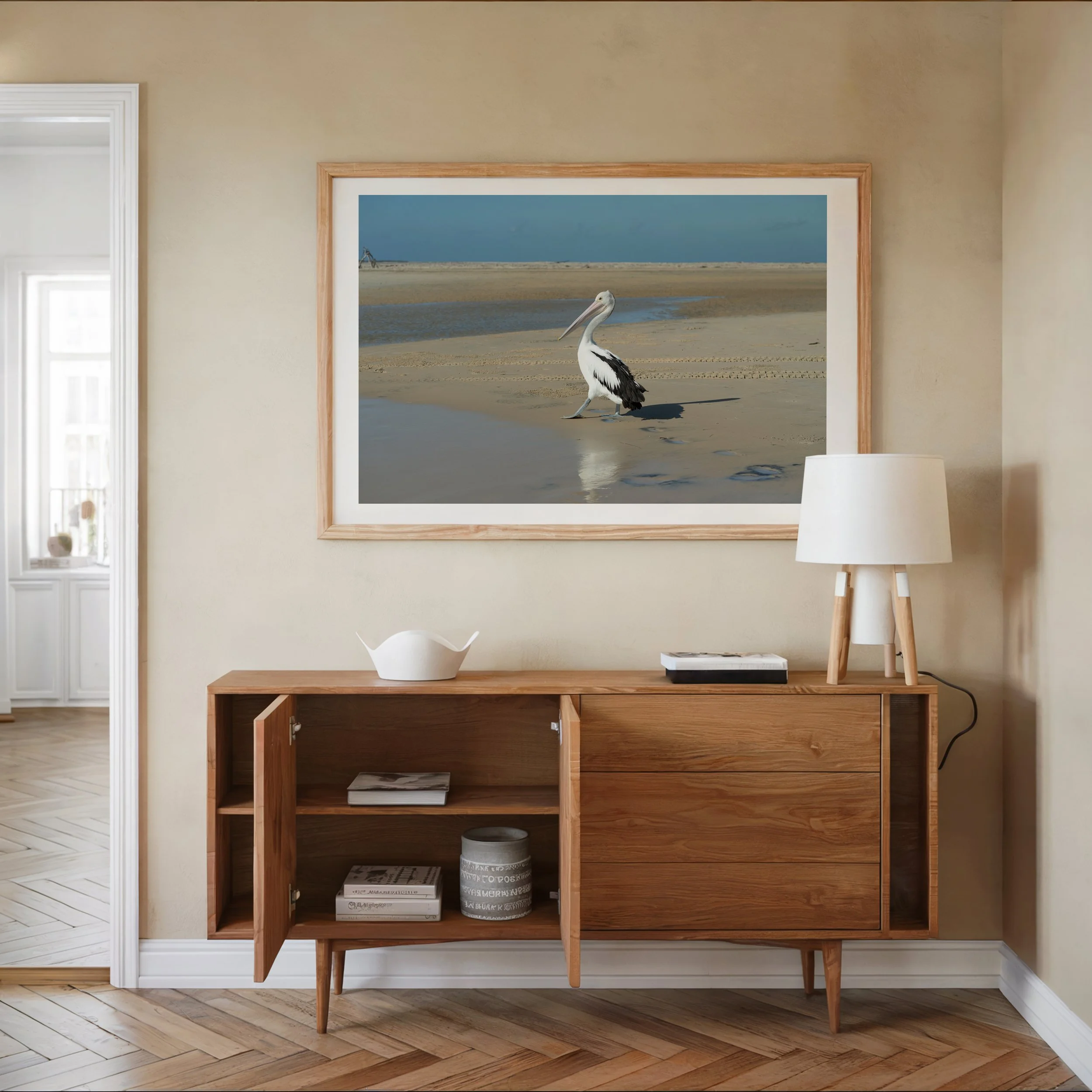 framed pelican print in a living room