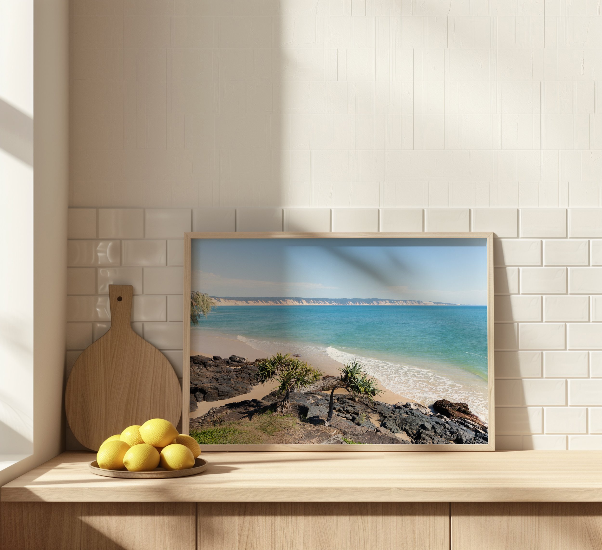 Coastal landscape print styled on a kitchen bench