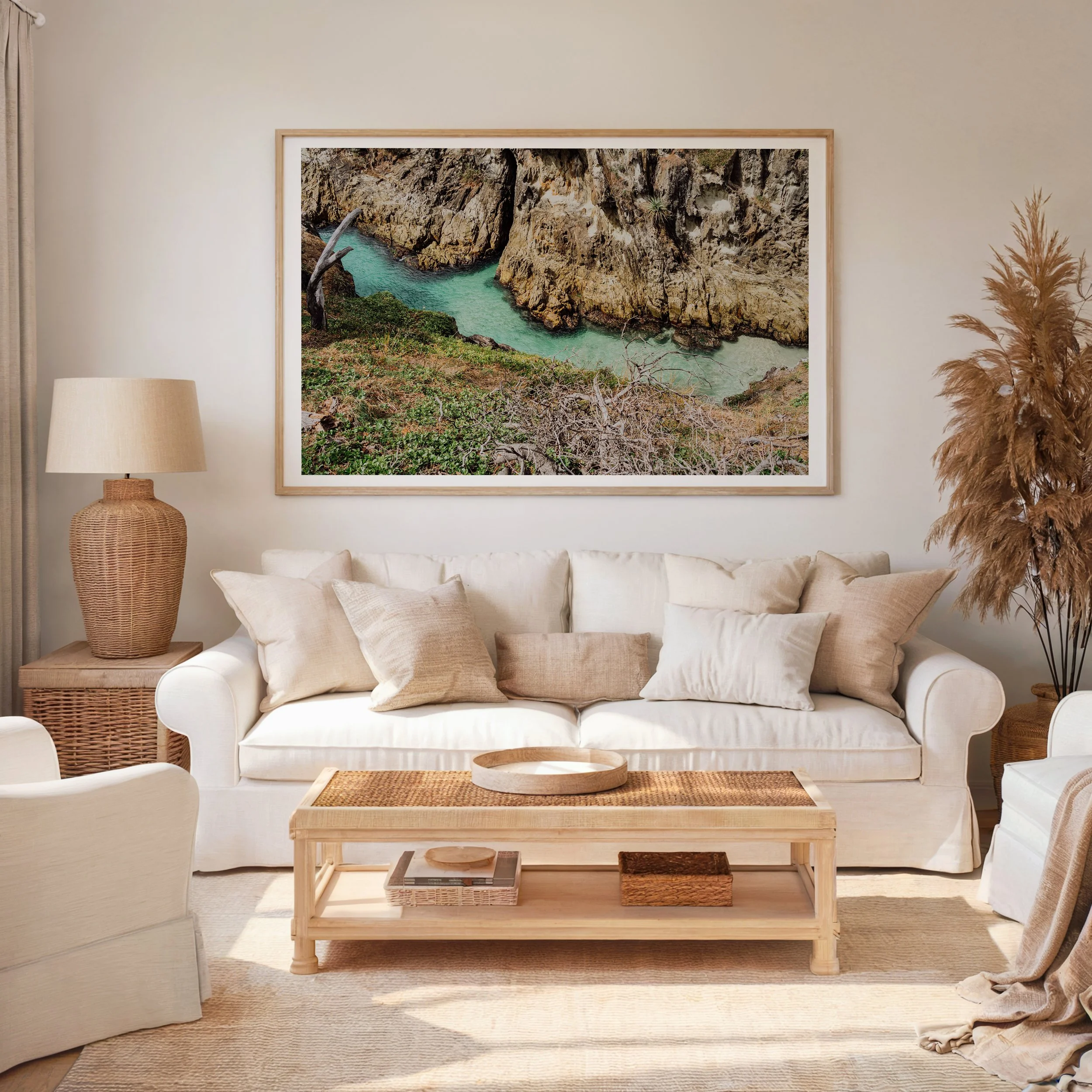 Framed gorge view coastal photograph displayed in a living room setting
