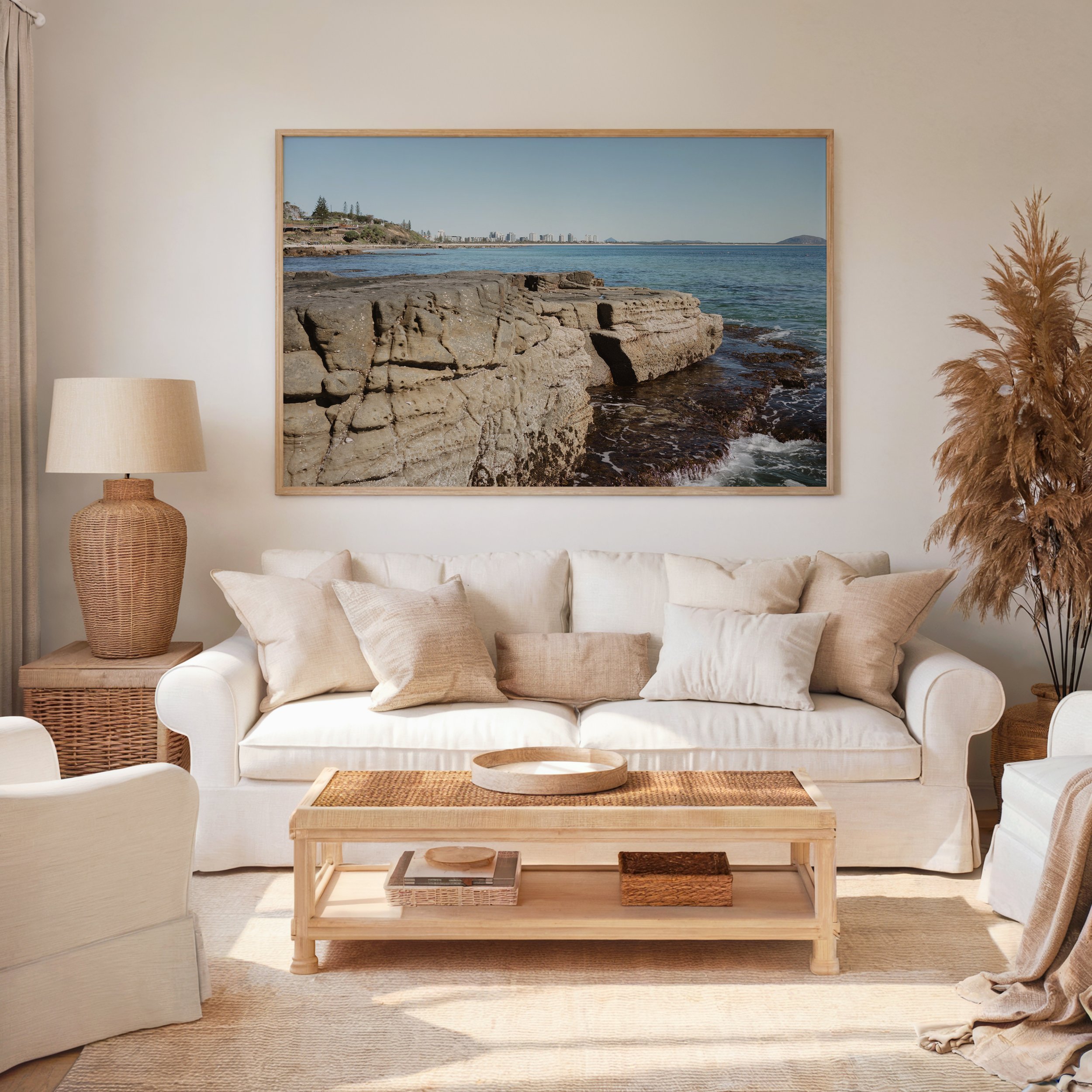 Framed Mooloolaba coastal photograph displayed in a living room setting