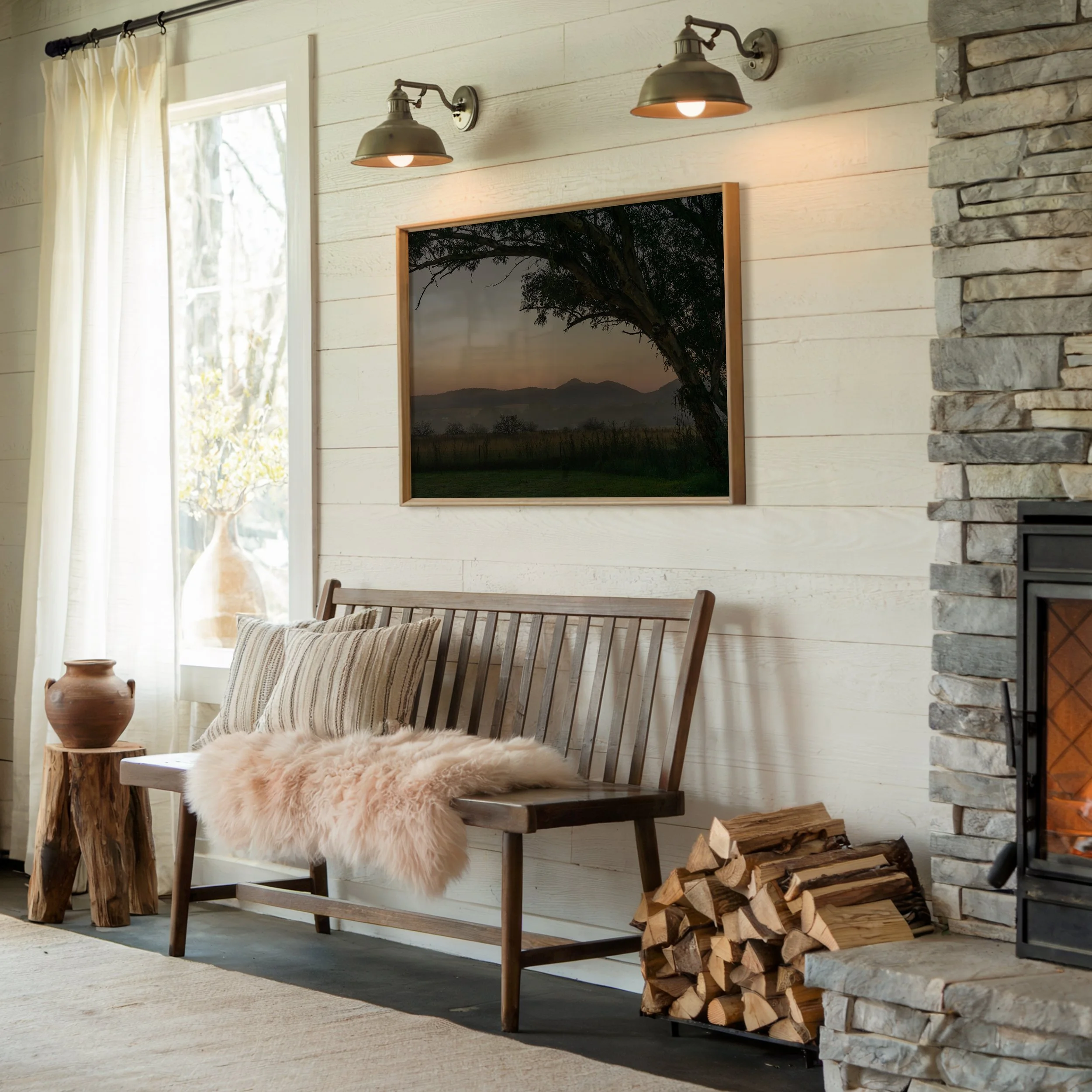 Framed sunrise landscape photograph displayed in a living room setting