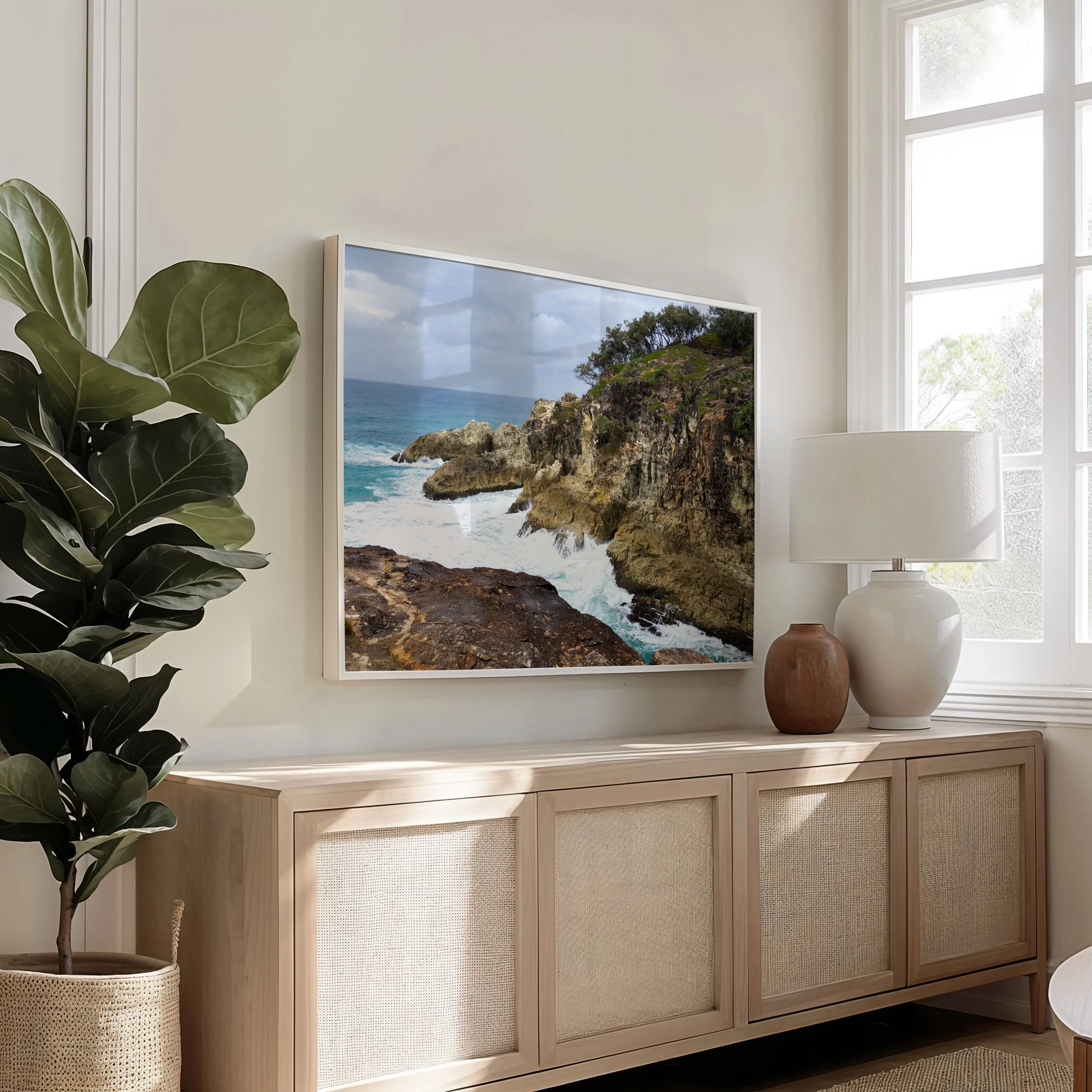 Framed Stradbroke Island Gorge photograph displayed in a living room setting