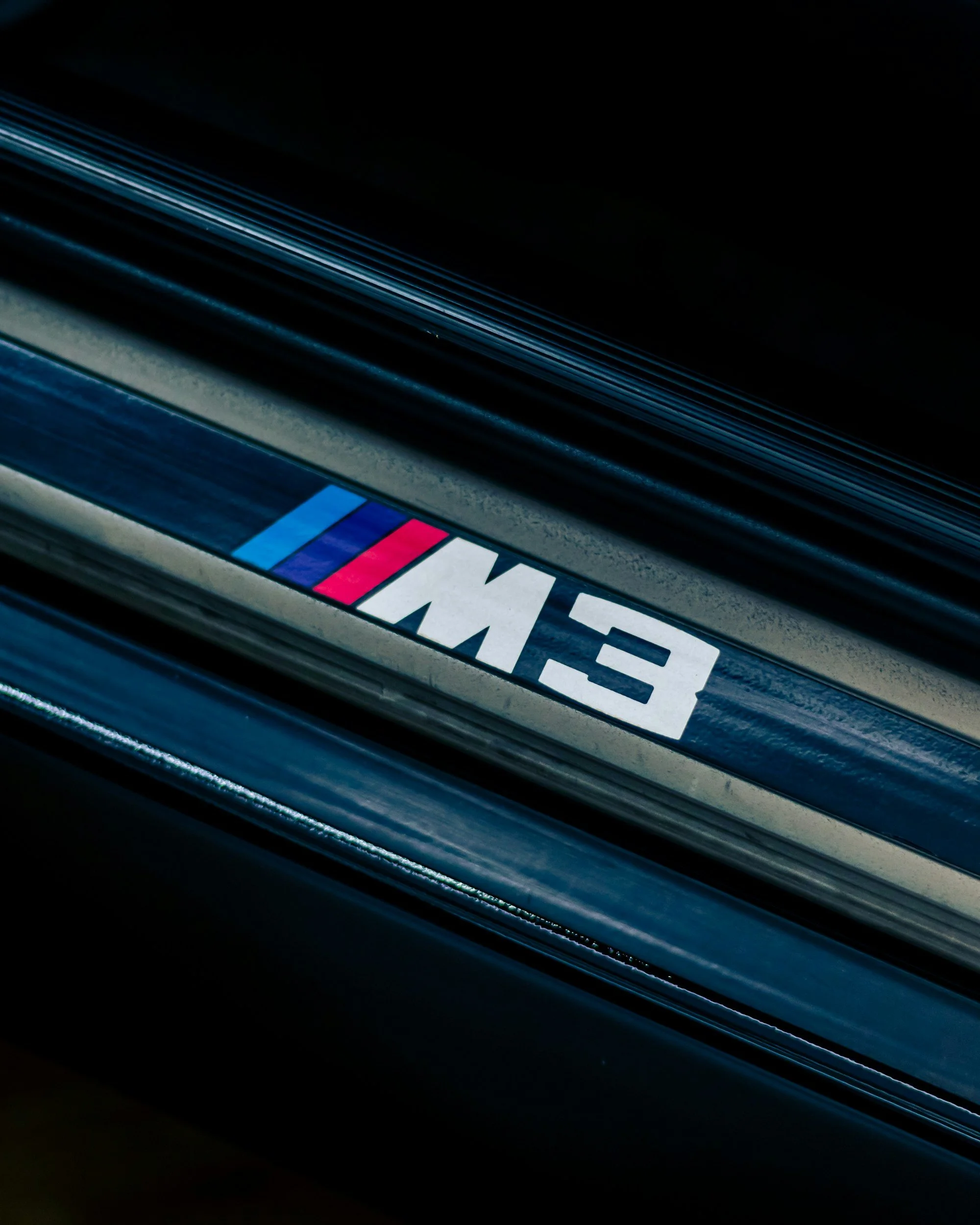 Close-up of an E46 M3 logo.