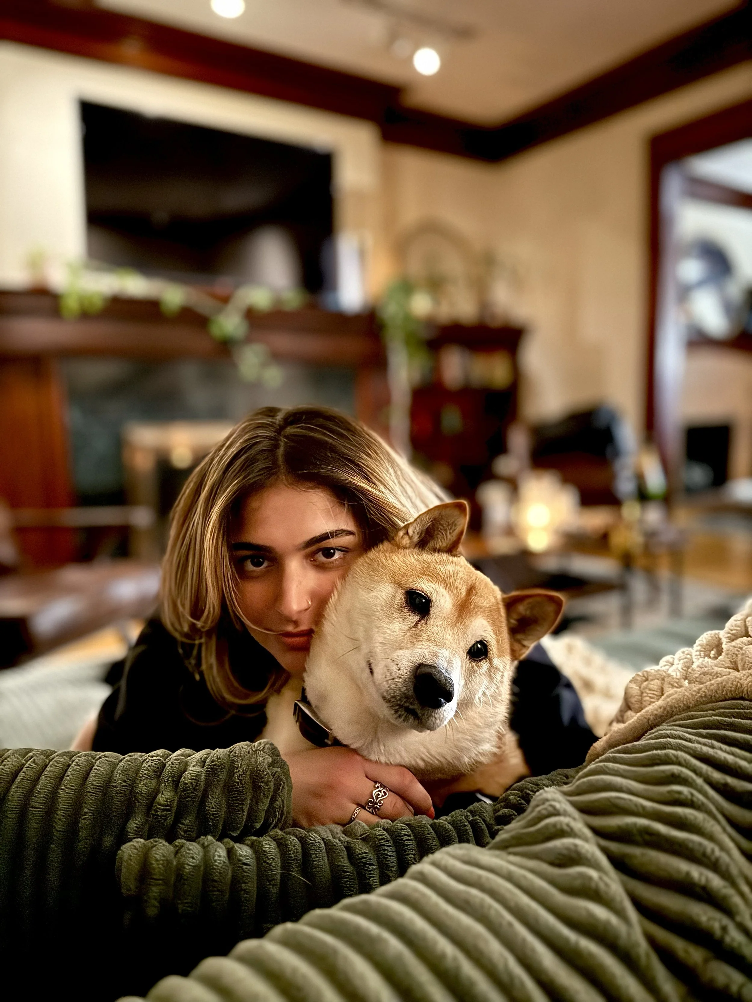 Ilana Foggle holding her Shiba Inu named Teddy.