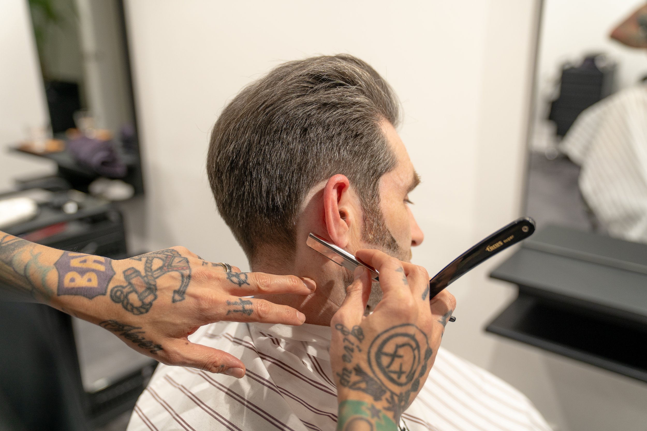 Precision haircut using a razor.