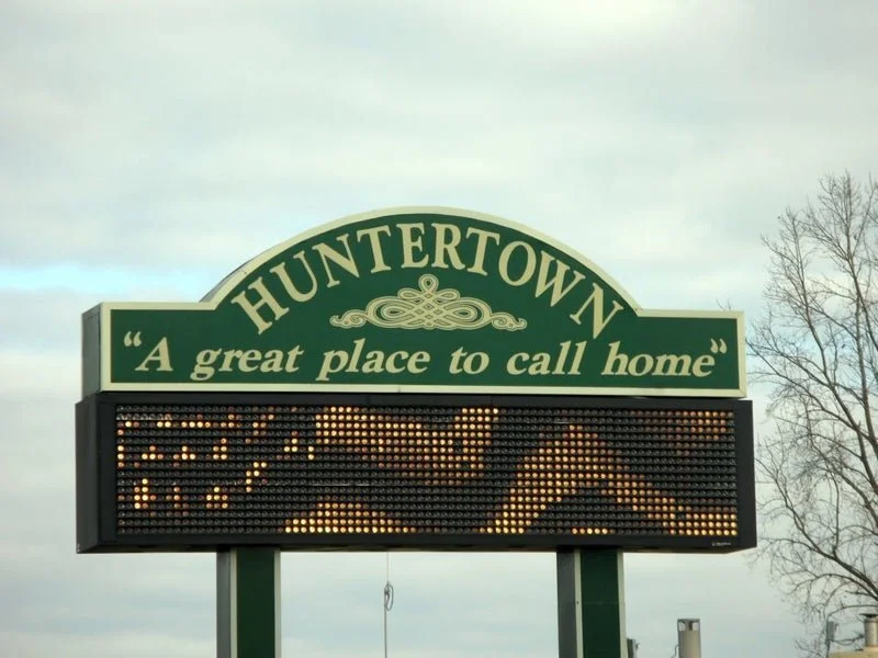 Huntertown welcome sign with the motto 'A great place to call home' and an electronic message board. Brittany Kindler