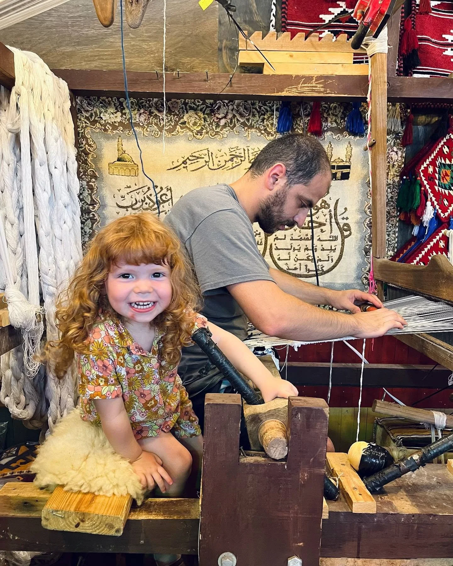 Mila on loom smiles.jpg