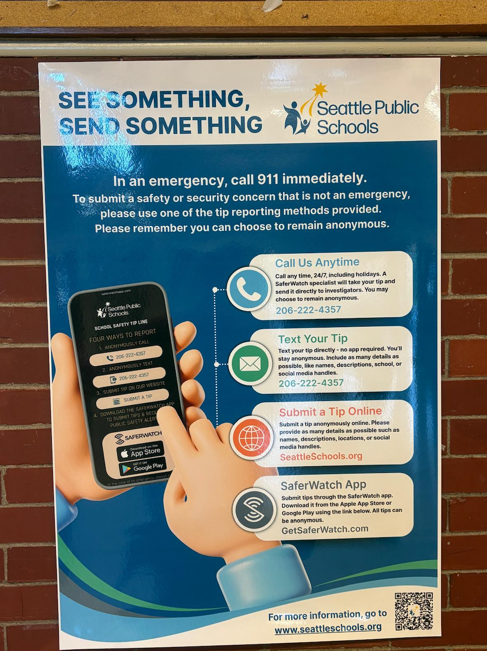 Photo of a Saferwatch poster in an SPS hallway. The poster is titled, "See something, send something" and lists ways for people to send anonymous tips to SaferWatch: call, text, web form, or using the SaferWatch app.