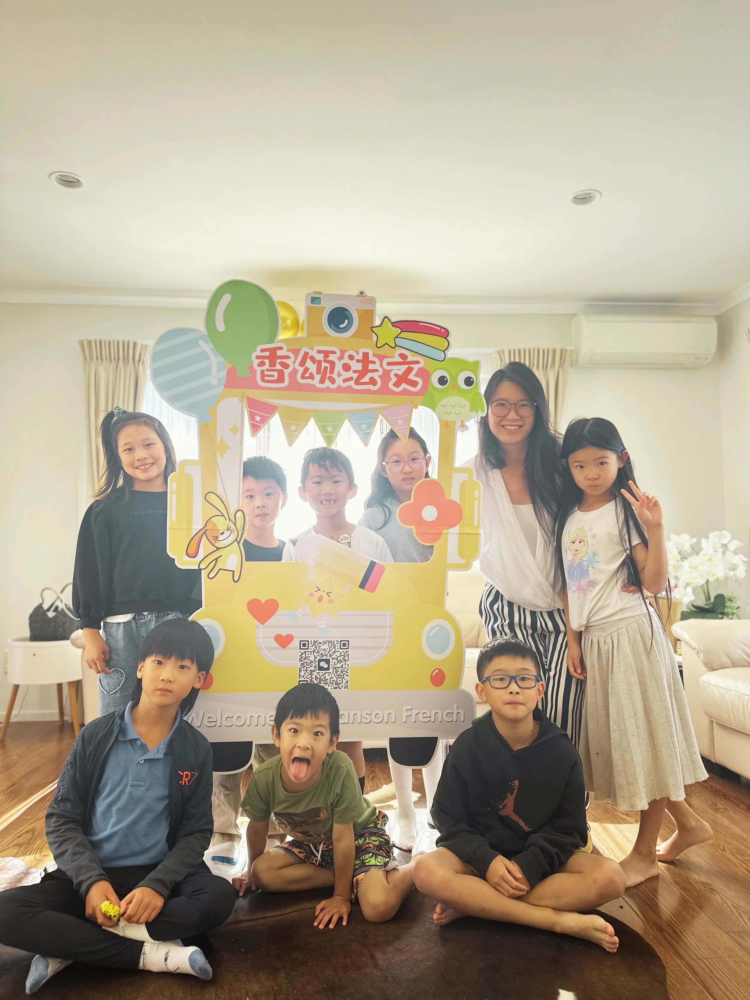 Children and teacher celebrating their first Chanson French Party in a fun, caring and connected French learning community