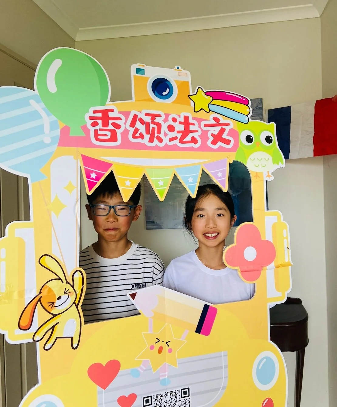 Students smiling at a Chanson French Party, learning French in a fun, caring and connected community