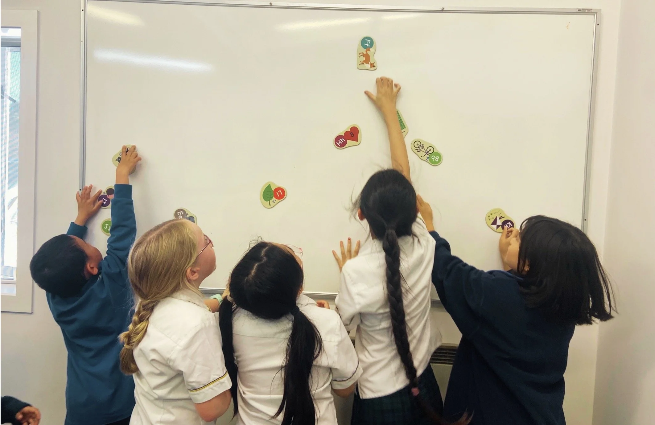 Children play French interactive games during Chanson Languages French Classes
