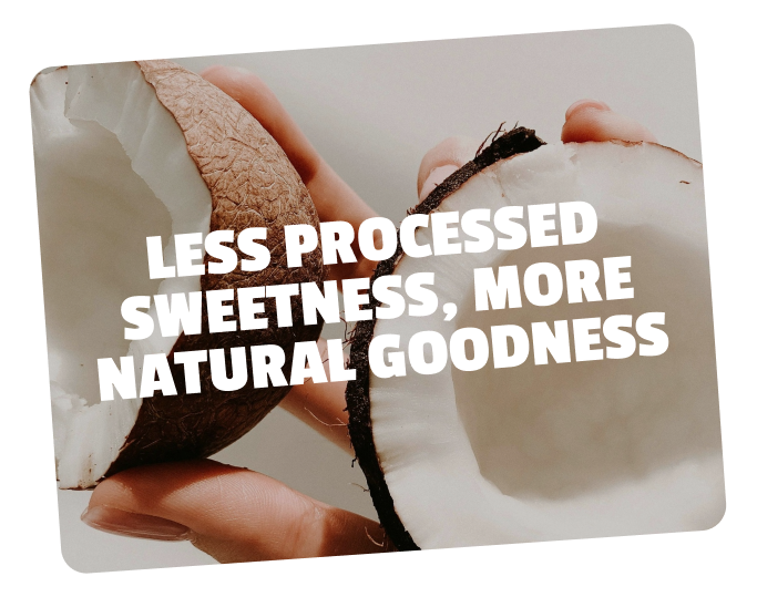 Close-up of a hand holding a coconut, with a focus on the coconut's rough exterior and white flesh inside, featuring overlaid text that reads 'Less processed sweetness, more natural goodness.'