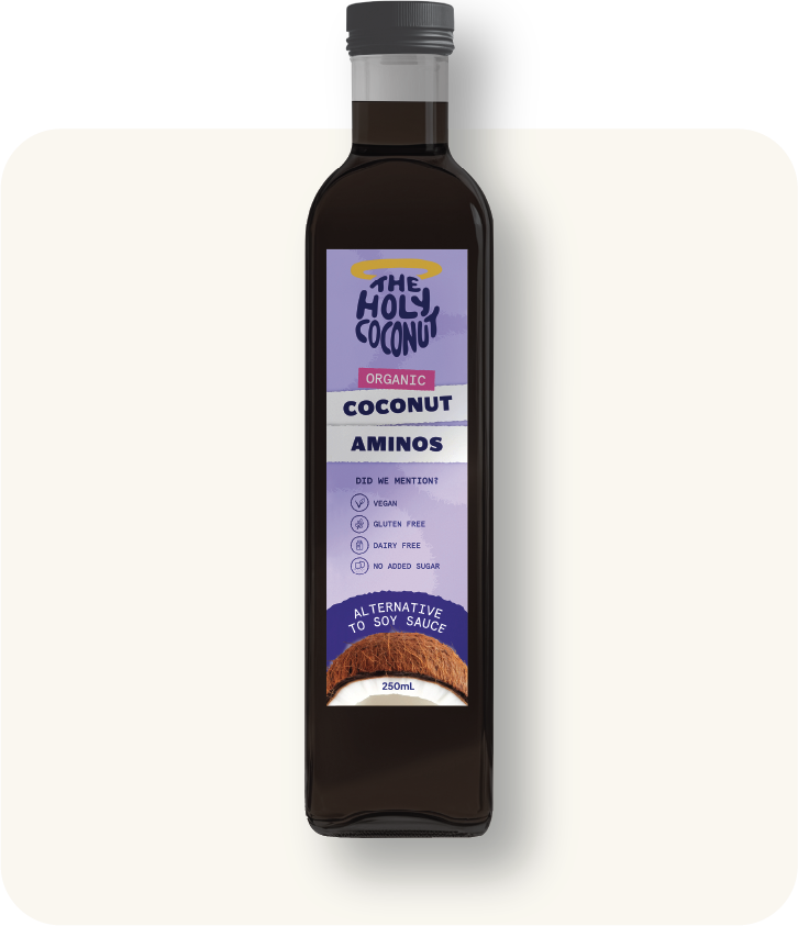 A 250ml dark glass bottle of The Holy Coconut organic coconut aminos with a purple label and a black screw cap, placed on a light background.