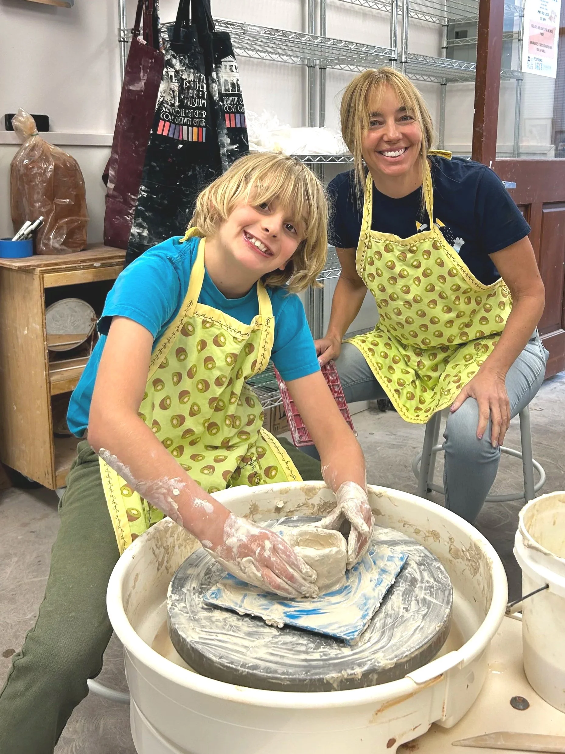 Joyous Mother and Son Wheel Throwing