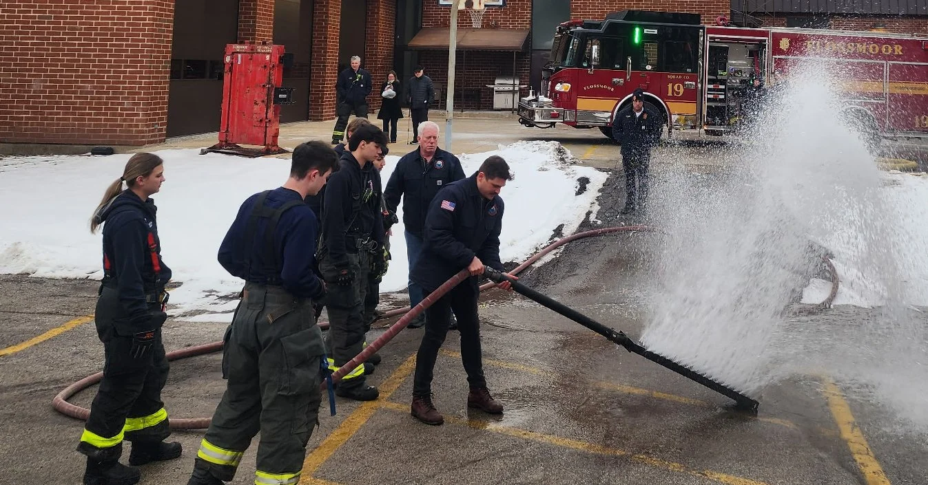 Firefighter Danny Puknaitis and Capt. Mike Jost demonstrating the Poseidon EV Fire and Hybrid Nozzle to fire departments.