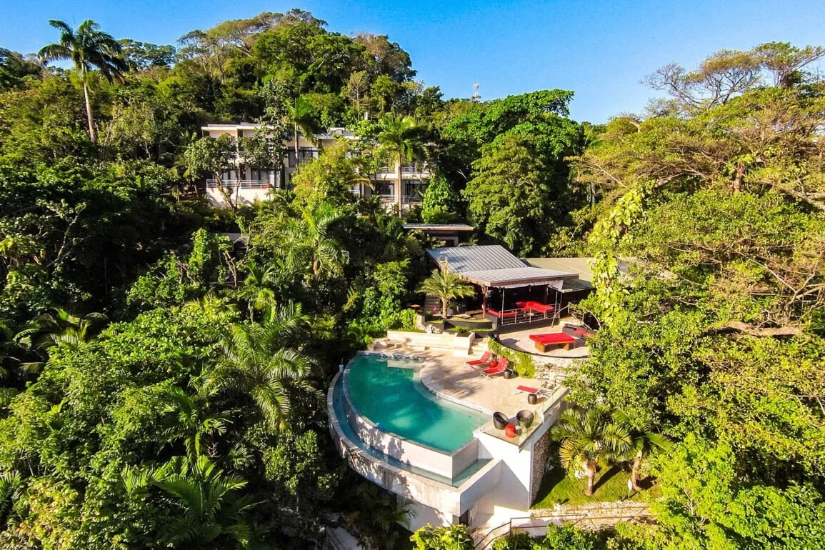 Aerial view of Geejam Hotel pool surrounded by tropical rainforest.