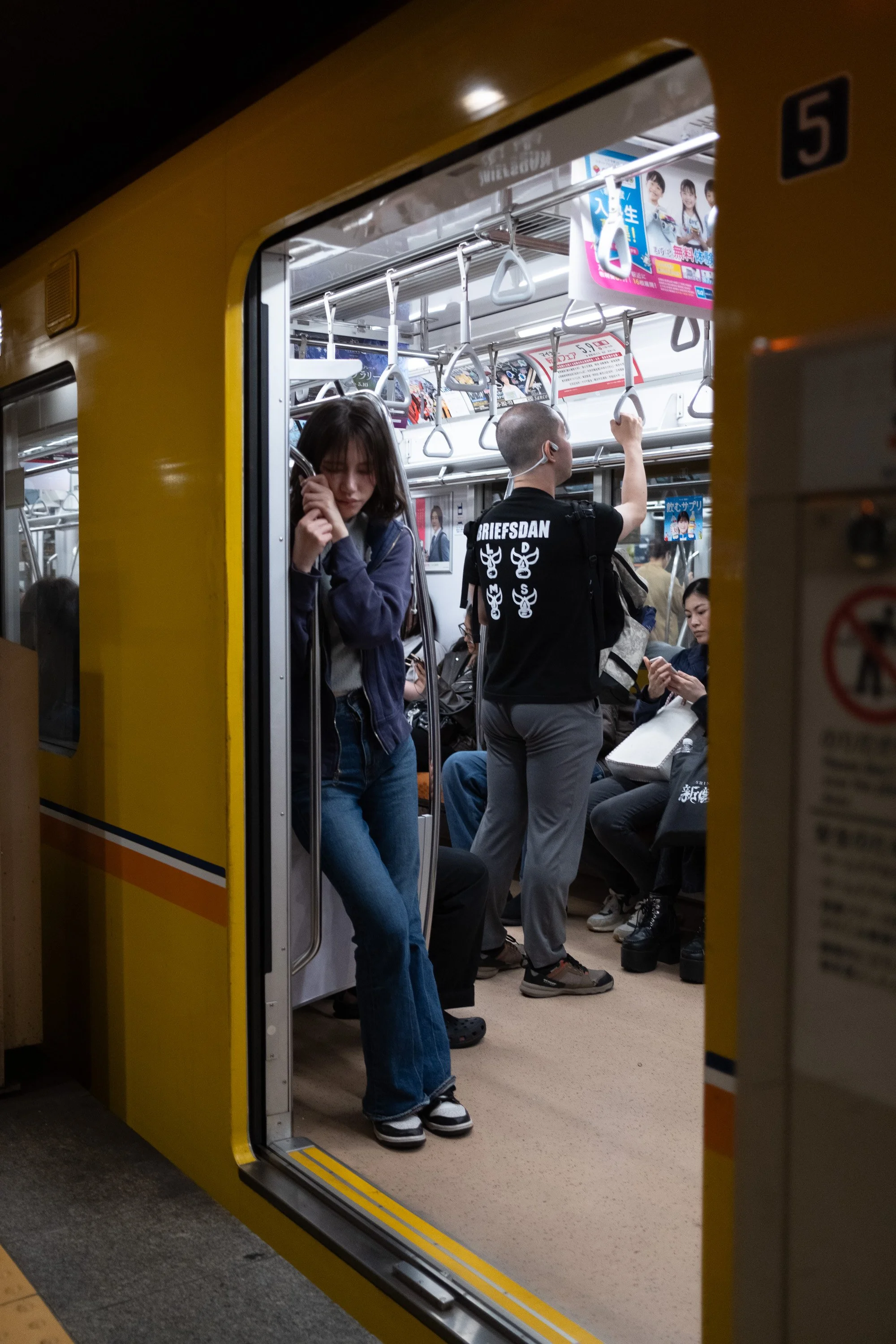 Tokyo_SubwayGril_HoldingOn.jpg