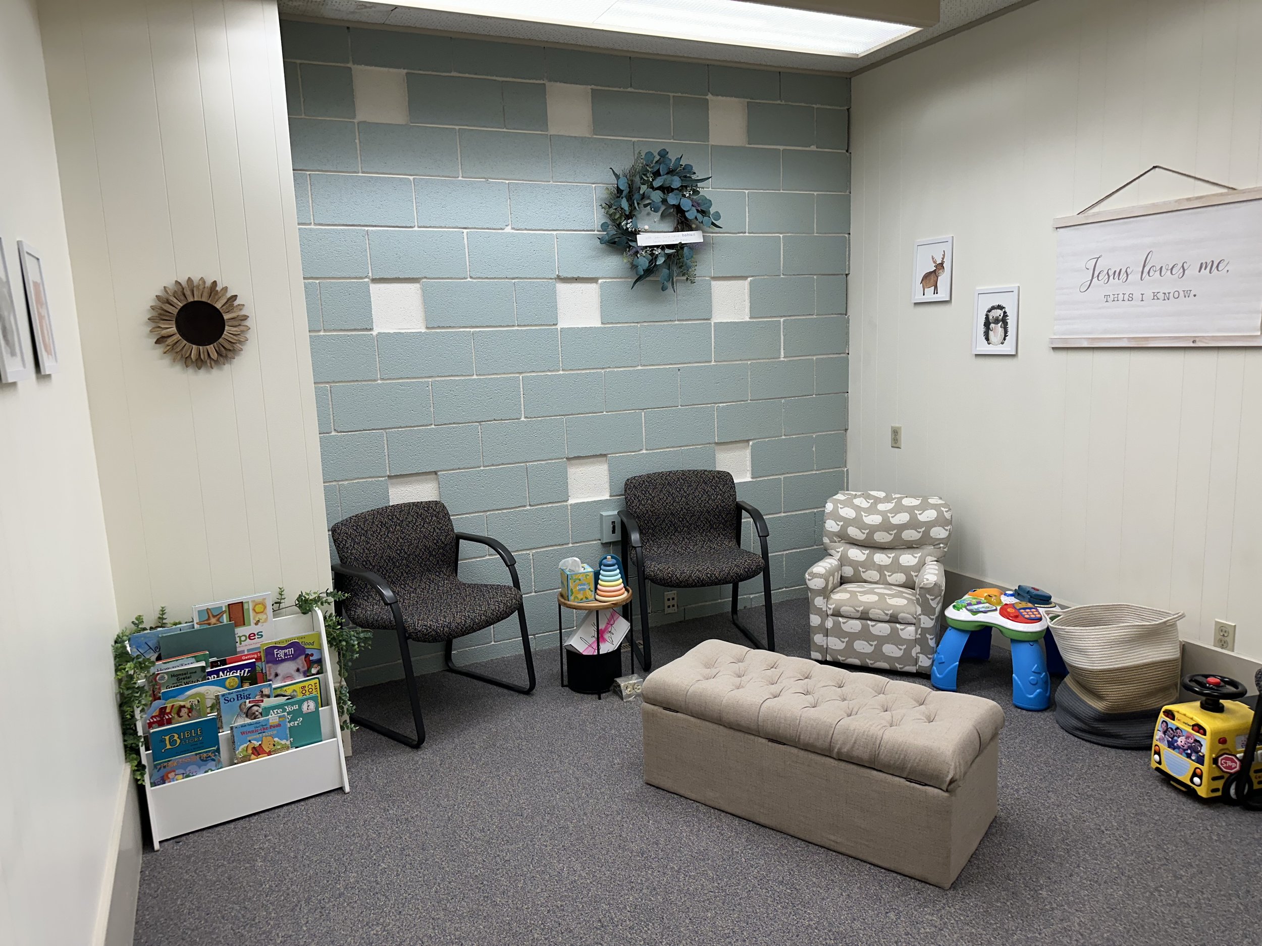 Inviting waiting room with children's books and a warm, inviting atmosphere.