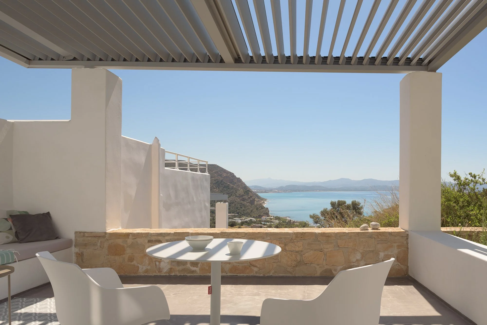 Modern boutique accommodation in South Crete with indoor-outdoor living concept.