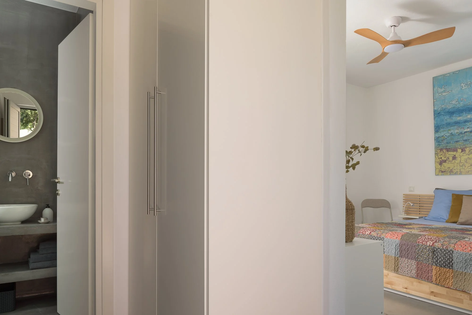 Soft minimalist bedroom interior at Galini Breeze designed for relaxed adults-only stays.