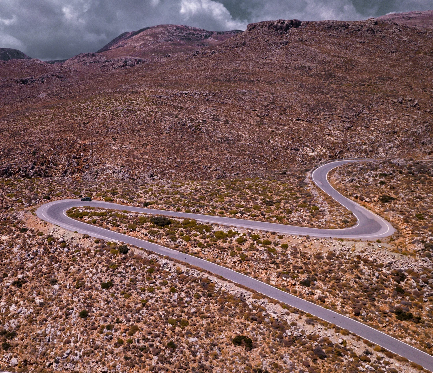 Mountain road driving through South Crete toward Agia Galini — spectacular gorge scenery on the route south