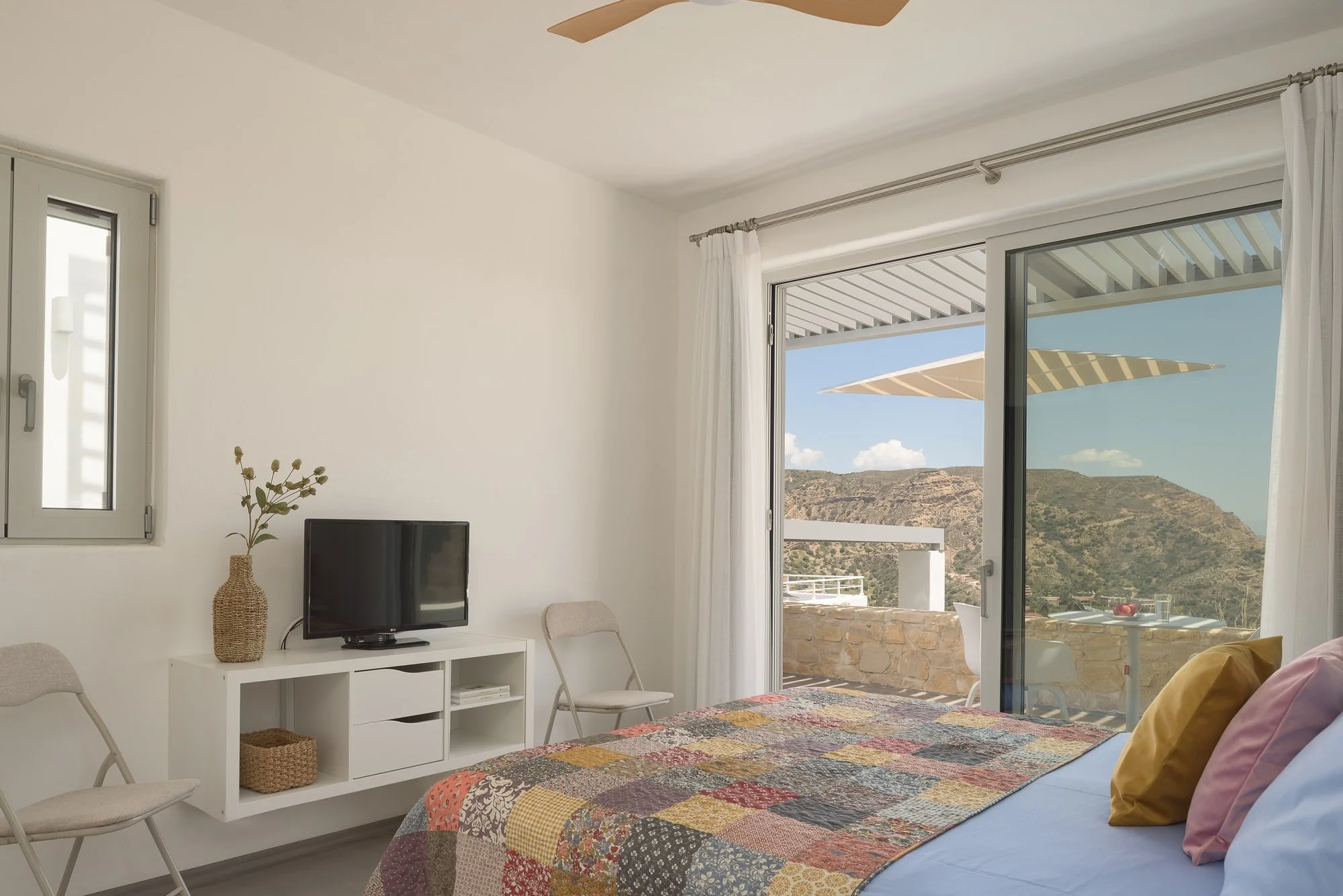 Modern boutique suite interior with terrace access and sea views at Galini Breeze, Agia Galini.