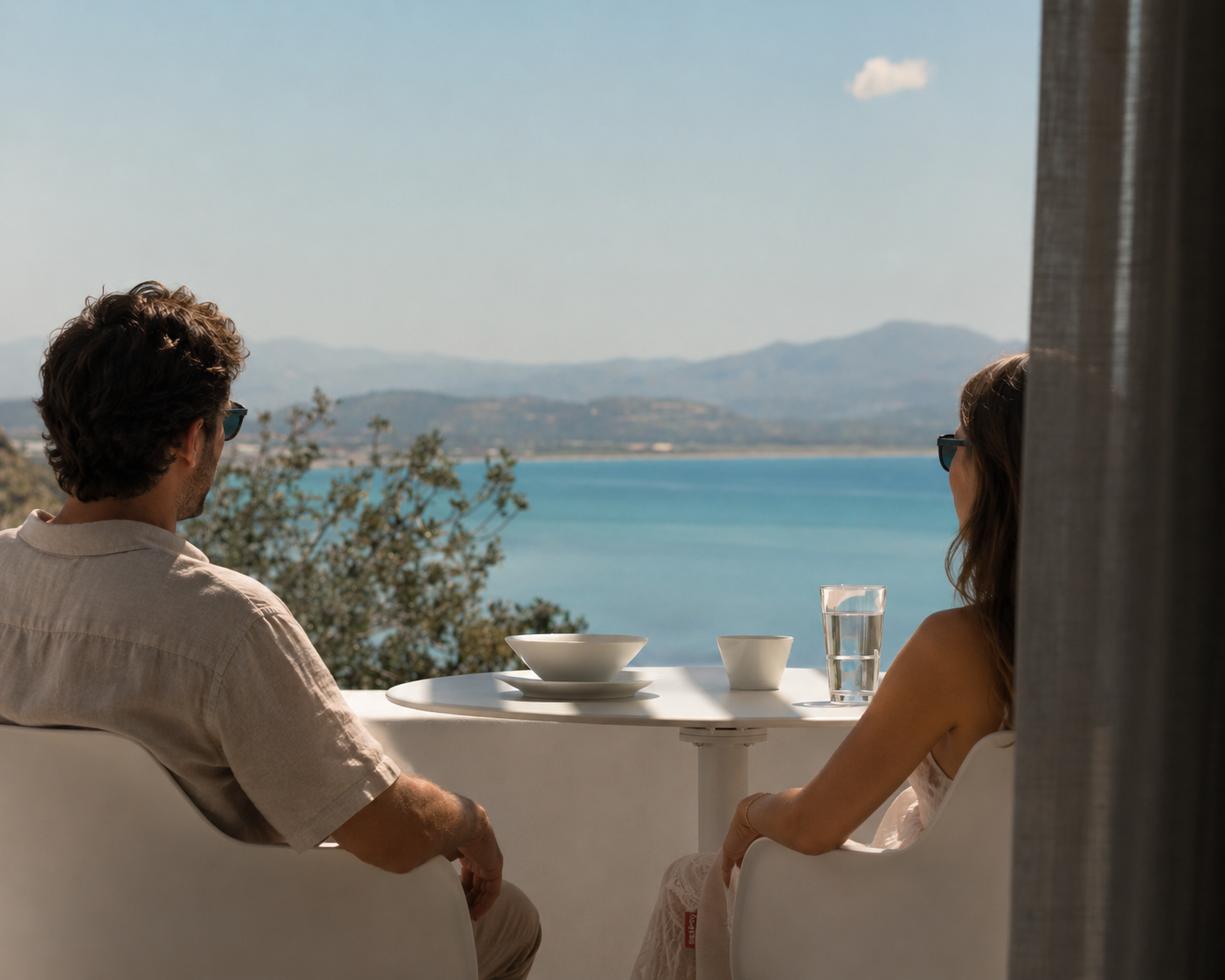 Couple enjoying a quiet breakfast with panoramic sea views during a slow travel adults-only holiday at Galini Breeze in South Crete near Agia Galini