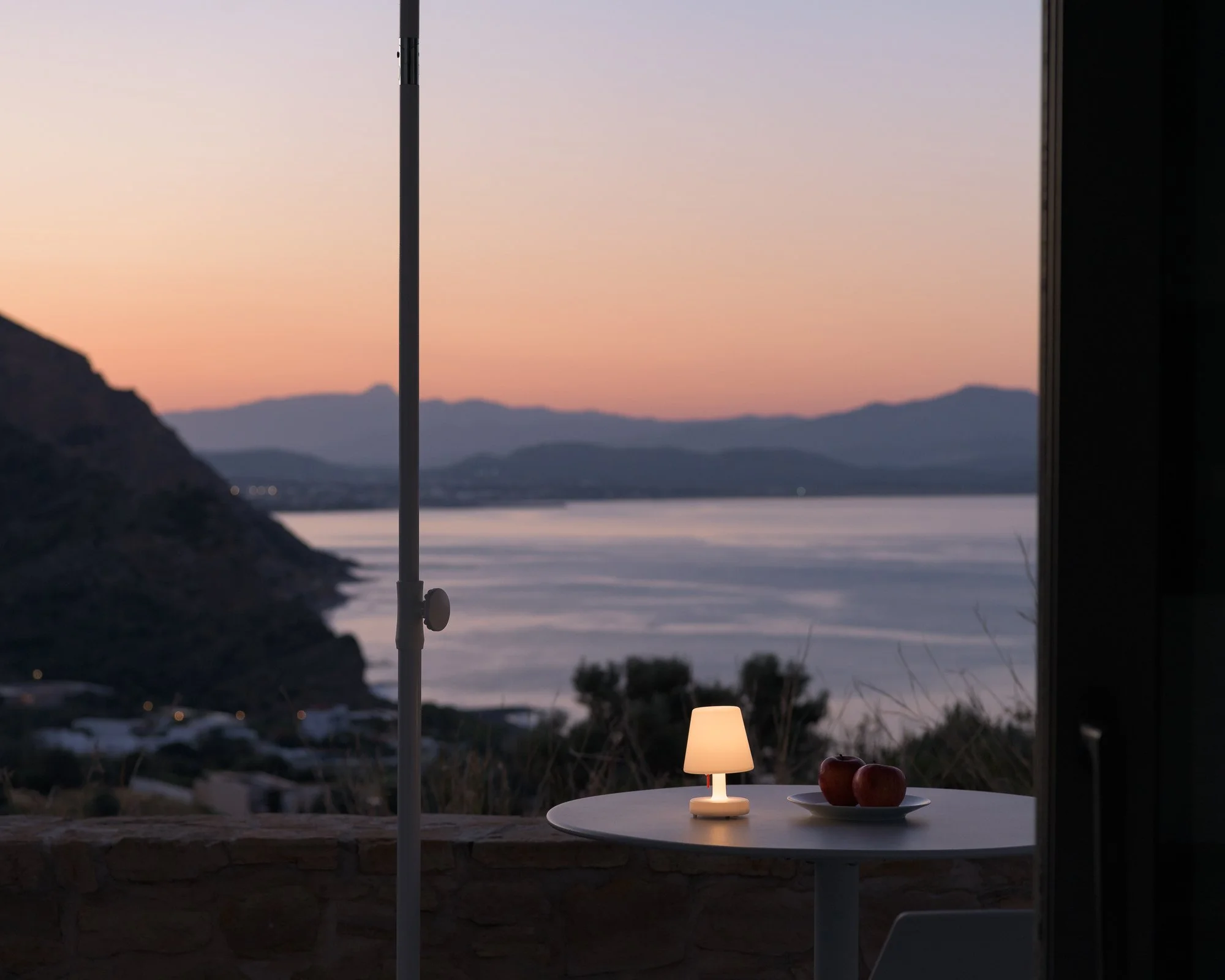 Twilight sea view from a minimalist suite overlooking Agia Galini and the Libyan Sea.