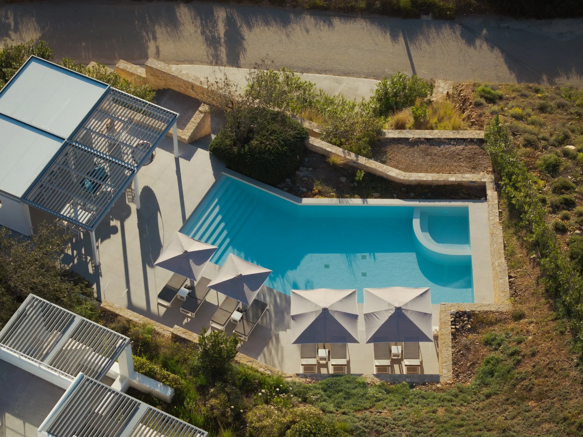 Aerial view of the heated swimming pool at Galini Breeze adults-only studios.