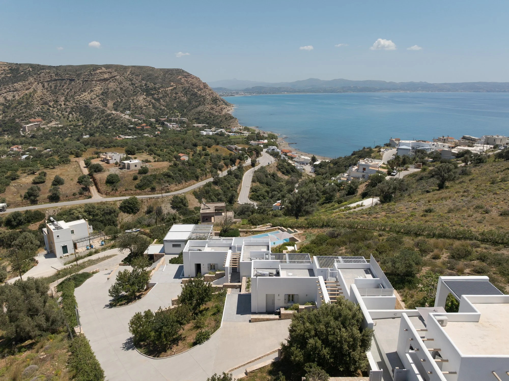 Aerial coastal view of Galini Breeze overlooking Agia Galini, the Libyan Sea and South Cretan mountains.