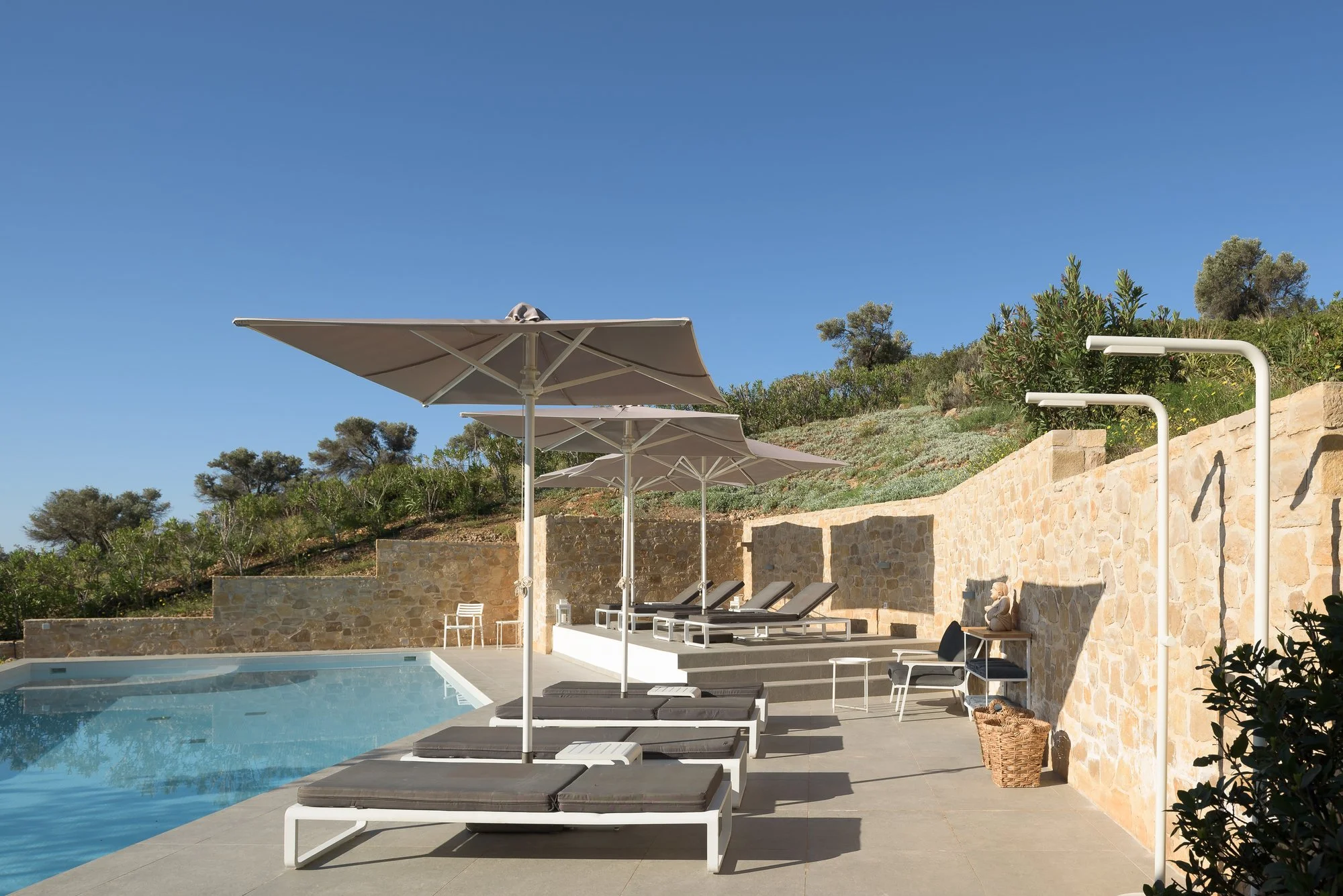 Infinity pool terrace at Galini Breeze overlooking the hills of Agia Galini and the Libyan Sea in South Crete.