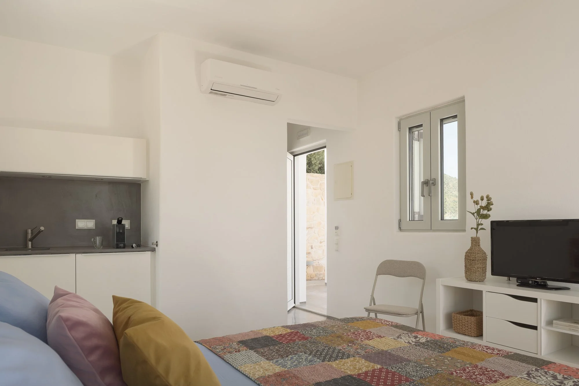 Bright contemporary living area with minimalist Mediterranean interior styling.